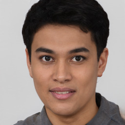 Joyful asian young-adult male with short  black hair and brown eyes