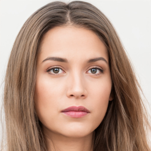 Neutral white young-adult female with long  brown hair and brown eyes