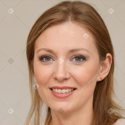 Joyful white young-adult female with long  brown hair and blue eyes