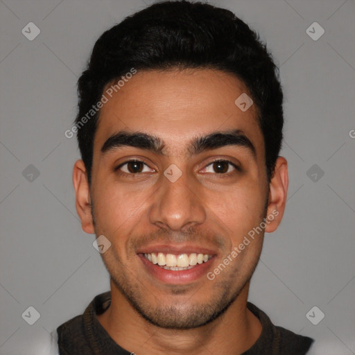 Joyful latino young-adult male with short  black hair and brown eyes