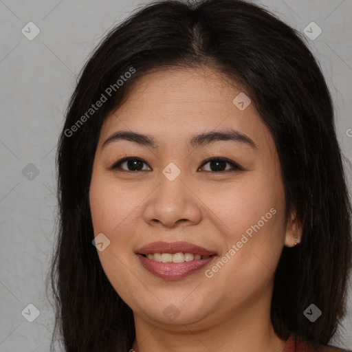 Joyful asian young-adult female with long  brown hair and brown eyes