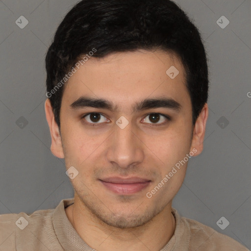 Joyful latino young-adult male with short  brown hair and brown eyes