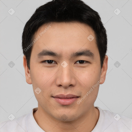 Joyful asian young-adult male with short  black hair and brown eyes