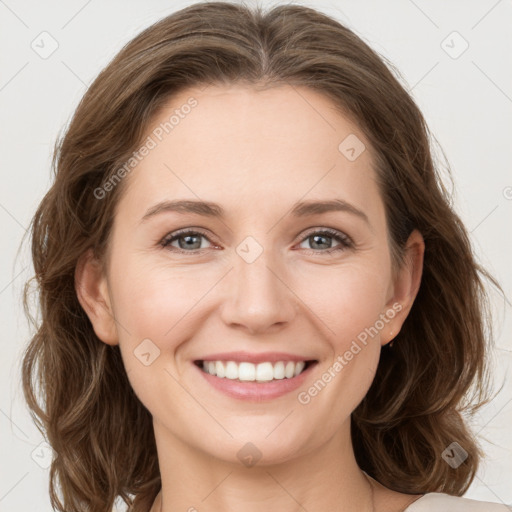 Joyful white young-adult female with medium  brown hair and green eyes