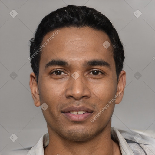 Joyful latino young-adult male with short  black hair and brown eyes