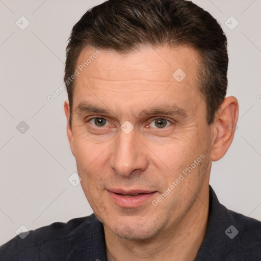 Joyful white adult male with short  brown hair and brown eyes