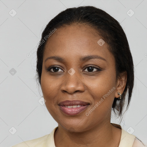 Joyful black young-adult female with medium  brown hair and brown eyes