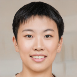 Joyful asian young-adult female with short  black hair and brown eyes