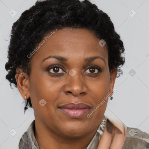 Joyful black adult female with short  brown hair and brown eyes