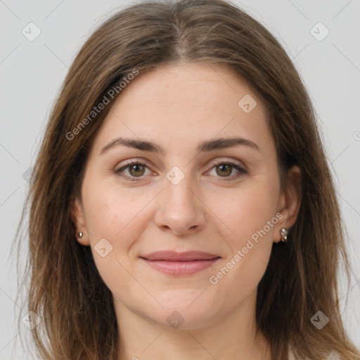 Joyful white young-adult female with long  brown hair and brown eyes