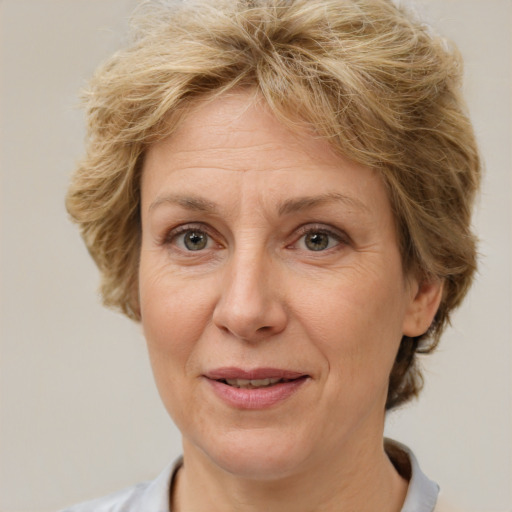 Joyful white middle-aged female with medium  brown hair and brown eyes