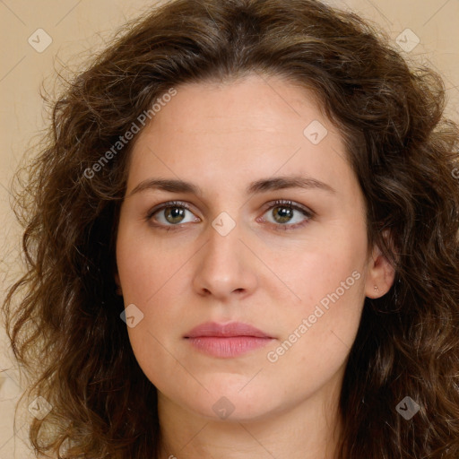 Joyful white young-adult female with long  brown hair and green eyes