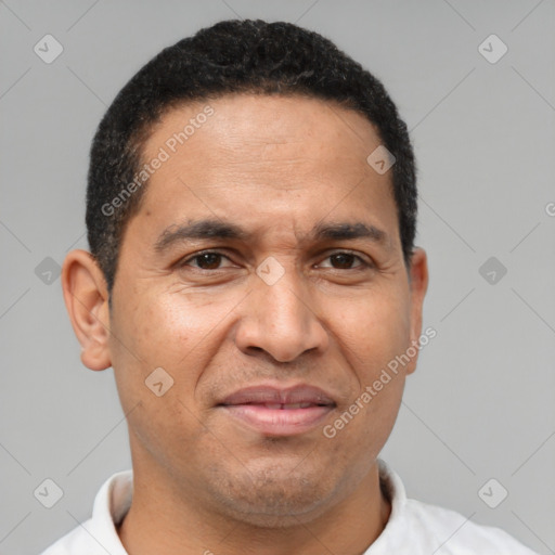 Joyful latino adult male with short  black hair and brown eyes