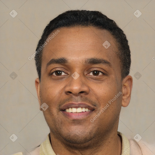 Joyful latino young-adult male with short  black hair and brown eyes