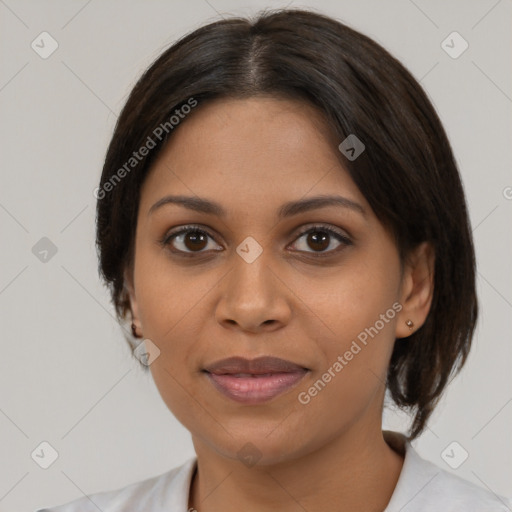 Joyful latino young-adult female with medium  brown hair and brown eyes