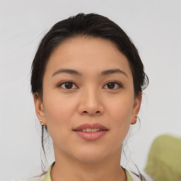 Joyful asian young-adult female with medium  brown hair and brown eyes