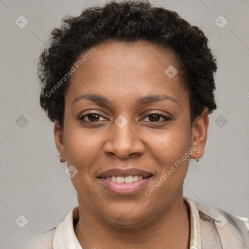 Joyful black young-adult female with short  brown hair and brown eyes