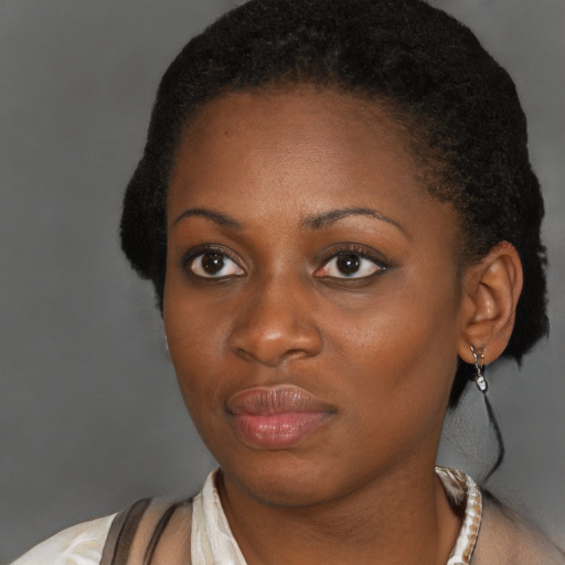 Neutral black young-adult female with short  brown hair and brown eyes