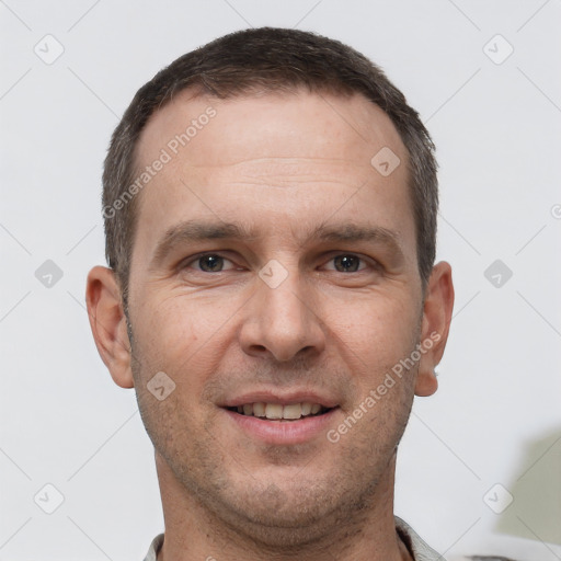 Joyful white adult male with short  brown hair and brown eyes