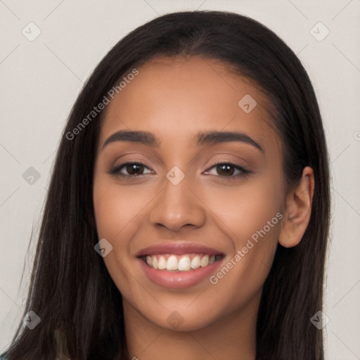 Joyful latino young-adult female with long  brown hair and brown eyes