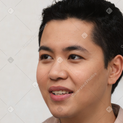 Joyful asian young-adult male with short  black hair and brown eyes