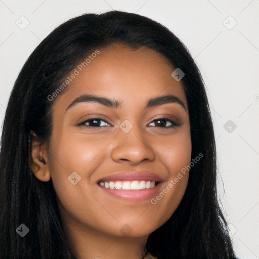 Joyful latino young-adult female with long  black hair and brown eyes