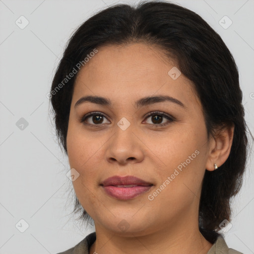 Joyful latino young-adult female with medium  brown hair and brown eyes