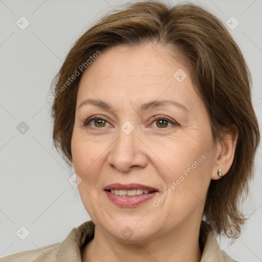 Joyful white adult female with medium  brown hair and brown eyes