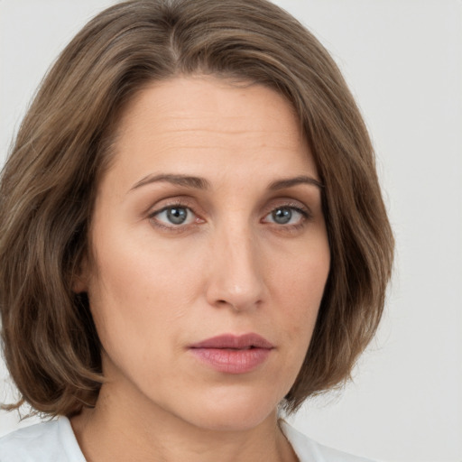 Neutral white young-adult female with medium  brown hair and green eyes