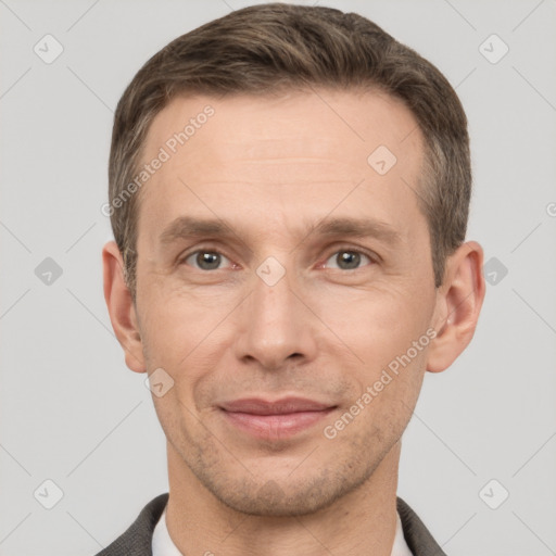 Joyful white adult male with short  brown hair and grey eyes