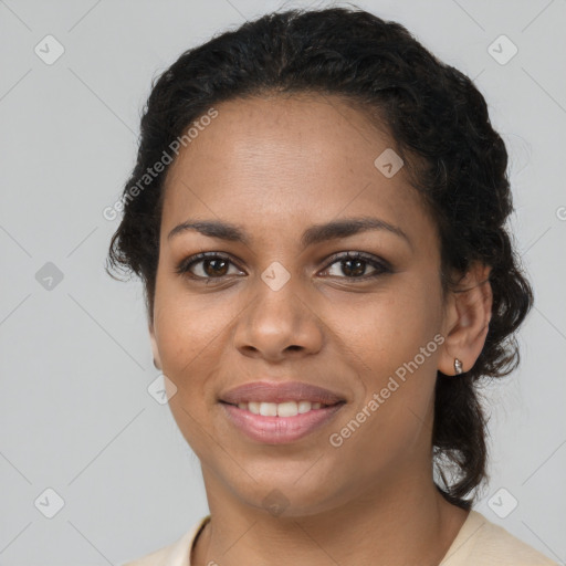 Joyful black young-adult female with medium  brown hair and brown eyes