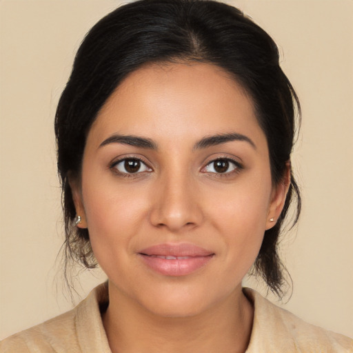 Joyful latino young-adult female with medium  black hair and brown eyes