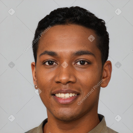 Joyful black young-adult male with short  black hair and brown eyes