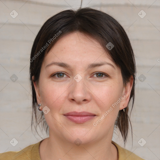 Joyful white adult female with medium  brown hair and grey eyes