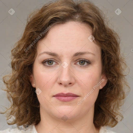 Joyful white young-adult female with medium  brown hair and green eyes