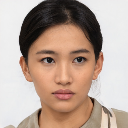Neutral asian young-adult female with medium  brown hair and brown eyes
