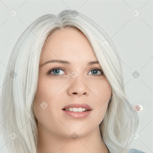 Joyful white young-adult female with long  blond hair and blue eyes