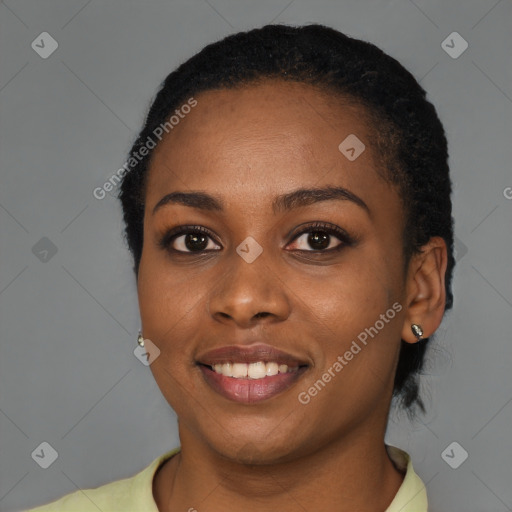 Joyful black young-adult female with short  black hair and brown eyes