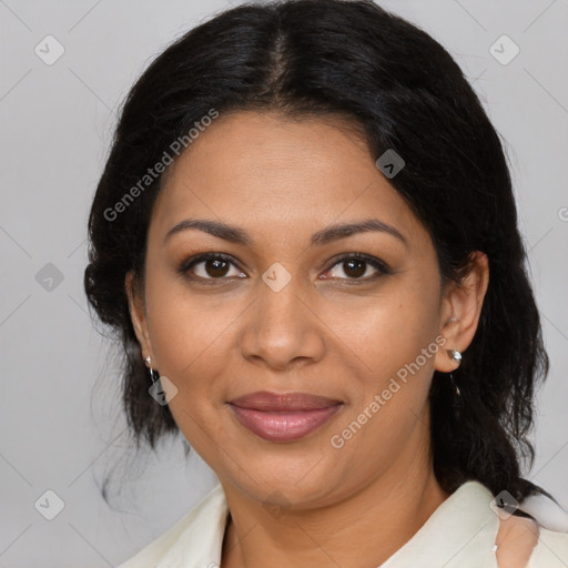 Joyful latino adult female with medium  brown hair and brown eyes