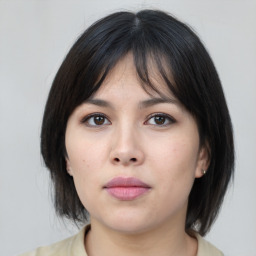 Neutral asian young-adult female with medium  brown hair and brown eyes