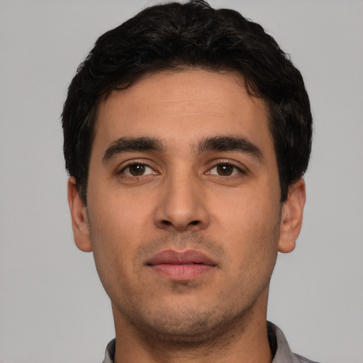 Neutral white young-adult male with short  black hair and brown eyes