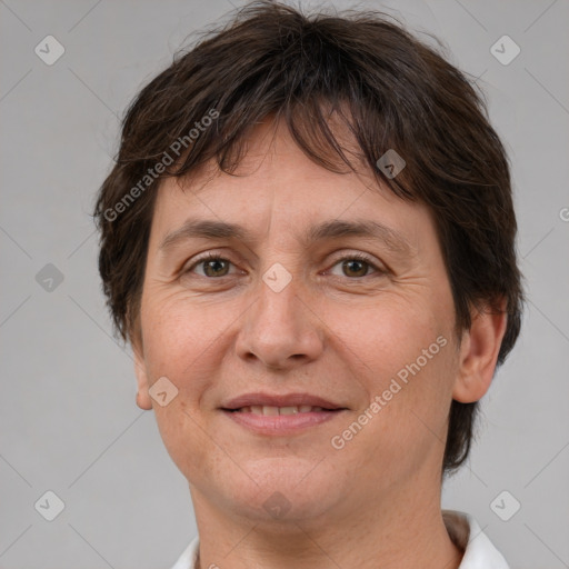 Joyful white adult female with short  brown hair and brown eyes