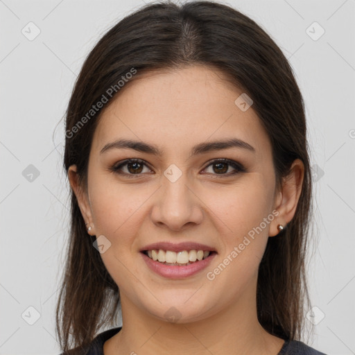 Joyful white young-adult female with long  brown hair and brown eyes