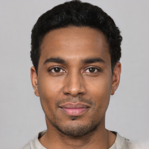 Neutral black young-adult male with short  black hair and brown eyes