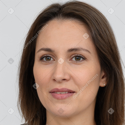 Joyful white adult female with long  brown hair and brown eyes