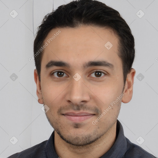 Joyful white young-adult male with short  black hair and brown eyes