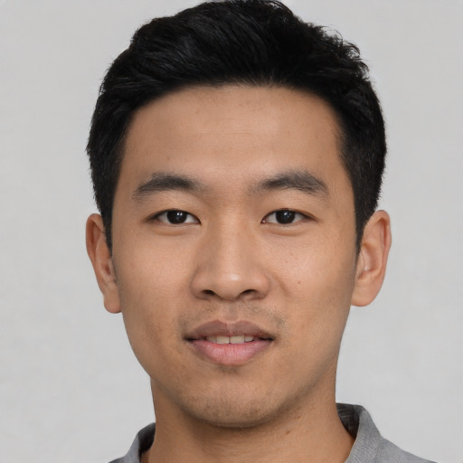 Neutral asian young-adult male with short  black hair and brown eyes