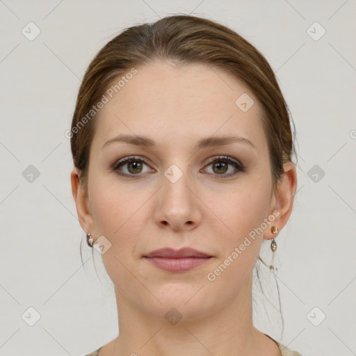 Joyful white young-adult female with medium  brown hair and grey eyes