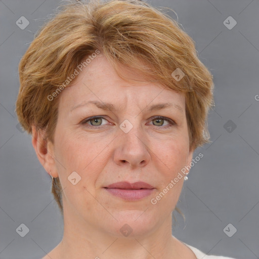 Joyful white adult female with medium  brown hair and blue eyes