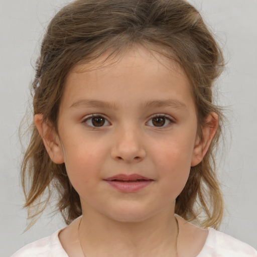 Joyful white child female with medium  brown hair and brown eyes